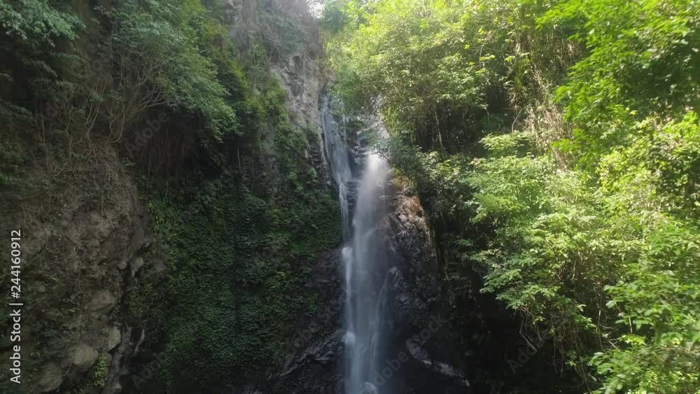 aerial view waterfall in green rainforest. tropical waterfall in mountain jungle. Bali,Indonesia. Travel concept. aerial view waterfall in green rainforest. tropical waterfall in mountain jungle. Bali,Indonesia. Travel concept.