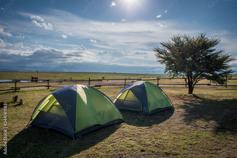 Two tents pitched at Amphitheatre Backpackers near Royal Natal National Park in KwaZulu Natal, South Africa