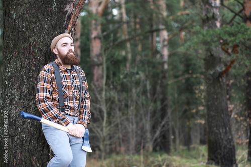 A bearded lumberjack with a large ax