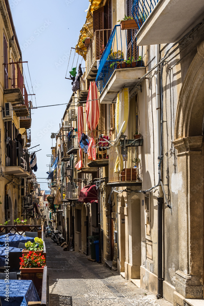 Colorful alley in Cefalù historc center, Palermo province, Sicily, Italy