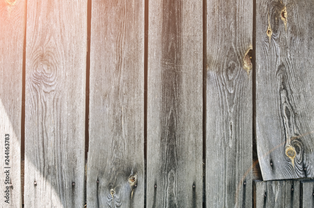 Naklejka premium Old vintage wooden planks of the house. Grey wood texture background.