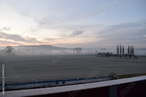 Wintersonnenaufgang in der Eifel, Thür photo