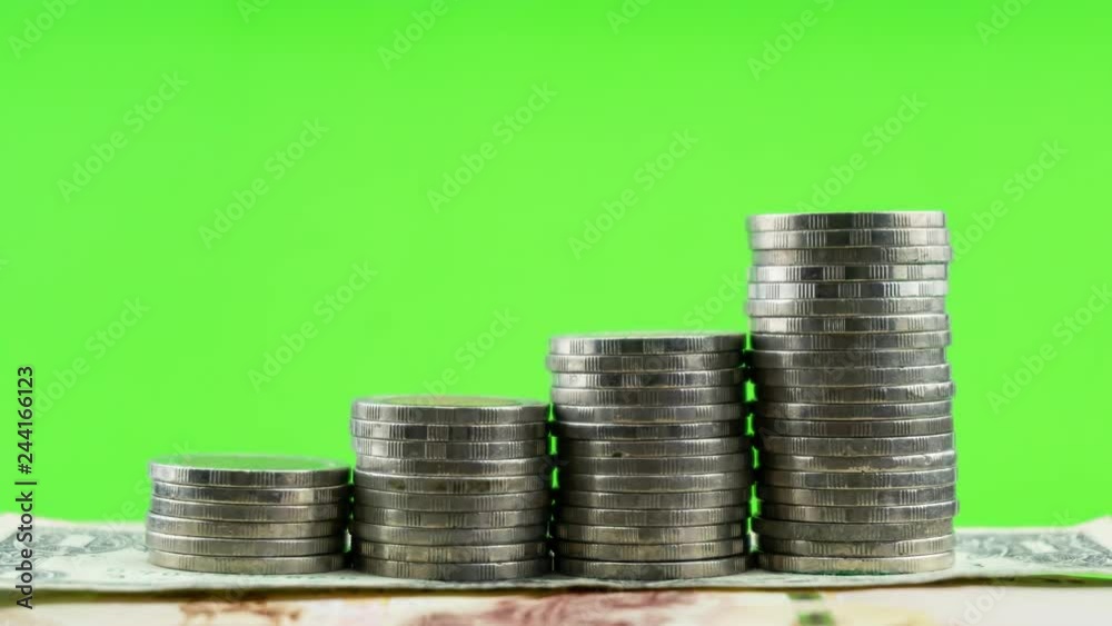4-K Time lapse of coins on money banknote green screen paper background