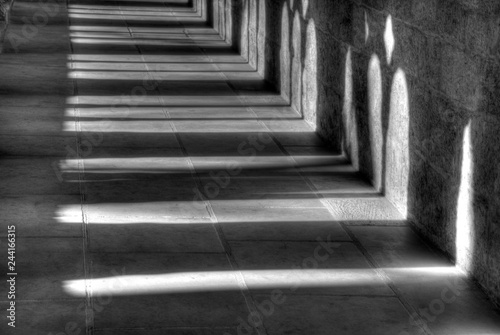 Light and shadow in the cloister in the Kaiserdom of Königslutter am Elm in bright sunshine