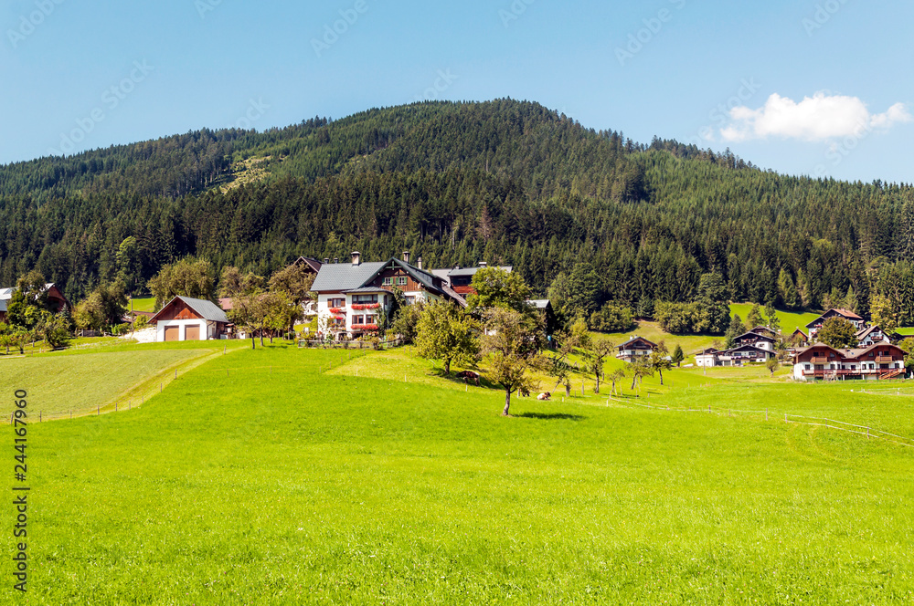 Village of Gosau with its wooden houses in the Alps of Austria on a sunny day.