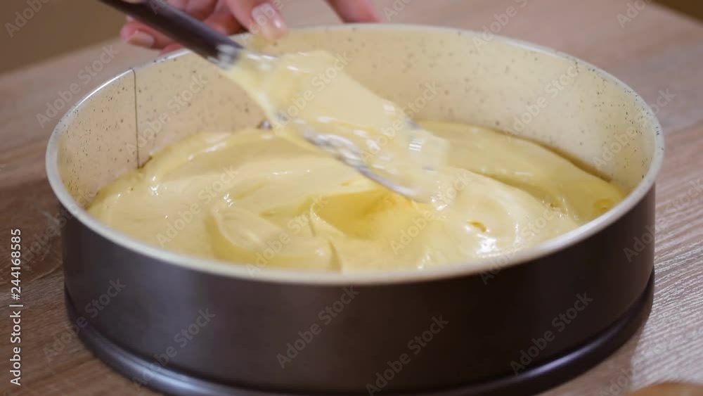 Cake batter in the baking dish. The process of cooking a cake Cake batter in the baking dish. The process of cooking a cake