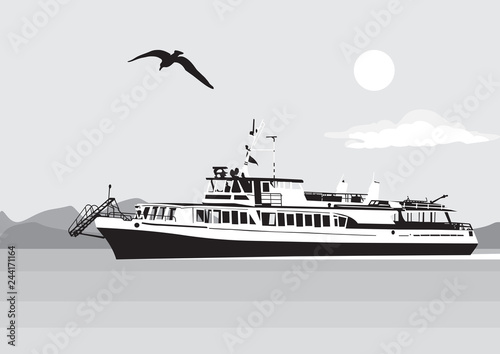 Ship in the open sea in the sky Seagull on the background of mountains