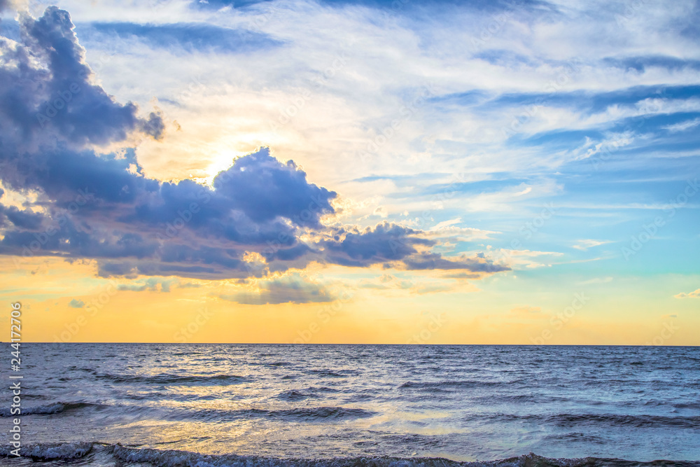 Fototapeta premium Atlantic Ocean Sunrise Background. Beautiful sunrise sky over the Atlantic Ocean in Myrtle Beach, South Carolina, USA.