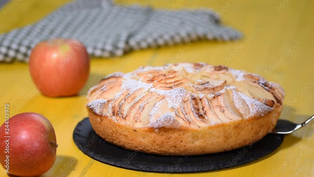 Homemade apple cake and apples on the table Homemade apple cake and apples on the table