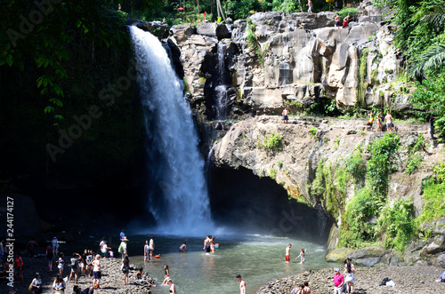 Bali / Indonesia - May 19 / 2017 : Tourists having fun at Blangsinga waterfall photo