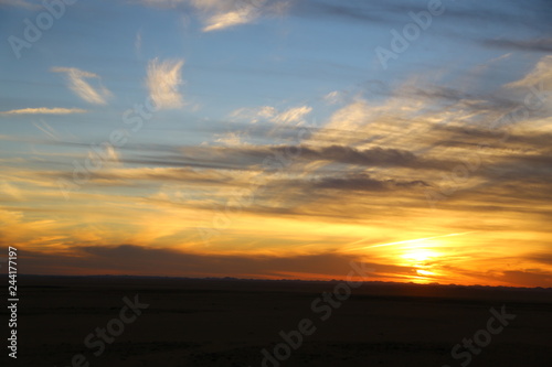 the light of the sunrise in the  desert