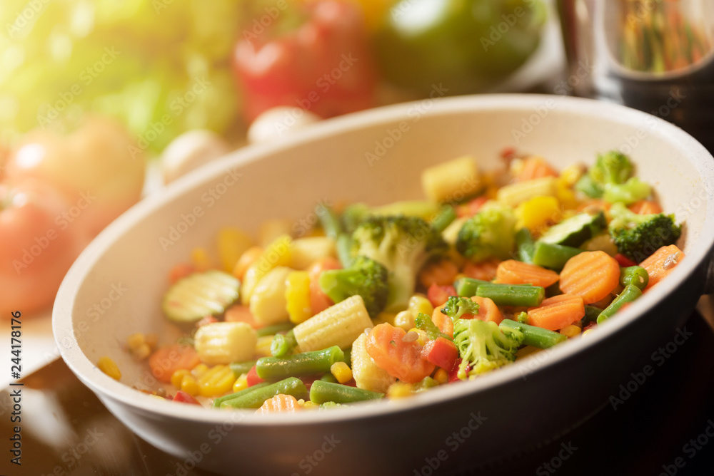 Fresh vegetables fried in a pan. Healthy nutrition concept