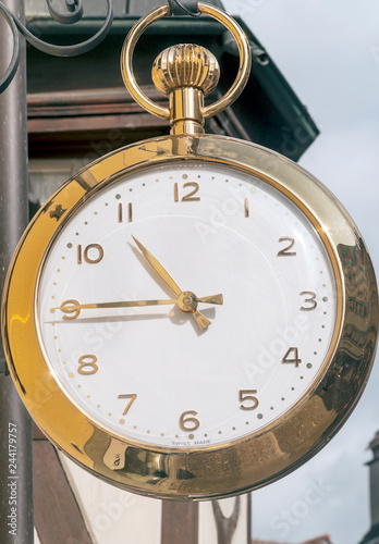 Clock in a steeple of a church of Steim am Reim in switzerland photo