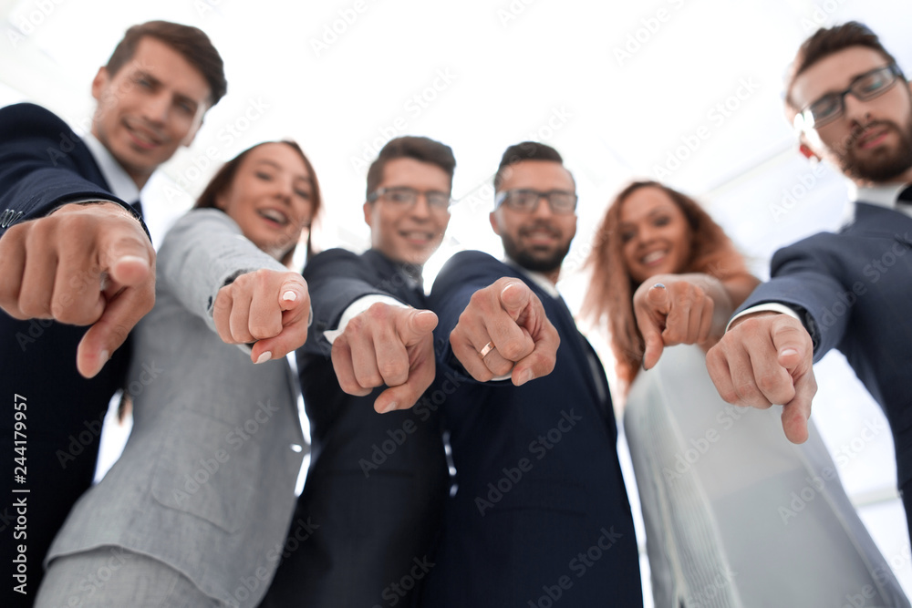 close up.successful business team pointing at you. close up.successful business team pointing at you.