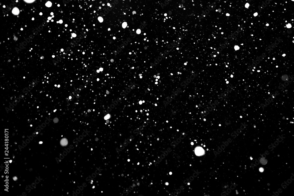 falling snow, white spots on a black background, snowfields on a black background