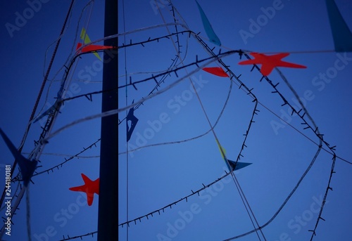 Fotografie Colorful decorations on a boat's mainmast