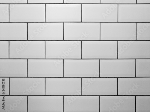 White metro tiles with grey grout. White rectangle tiled background