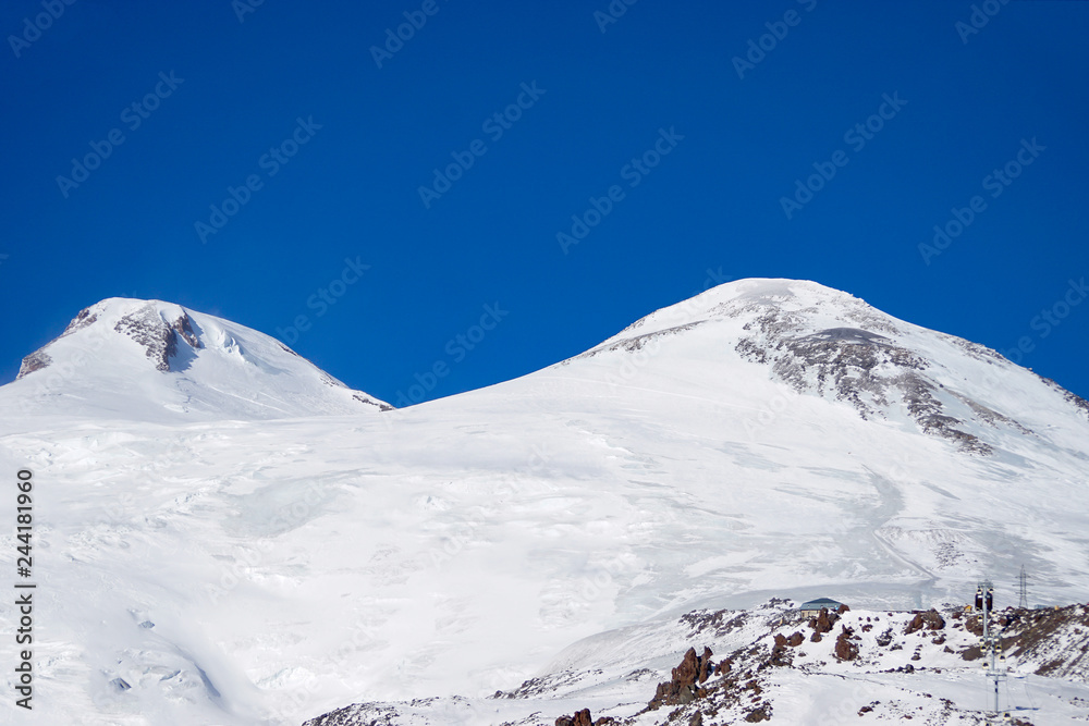 Snowboarding and skiing. The peaks of Elbrus. North Caucasus Russia. Snowboarding and skiing. The peaks of Elbrus. North Caucasus Russia.