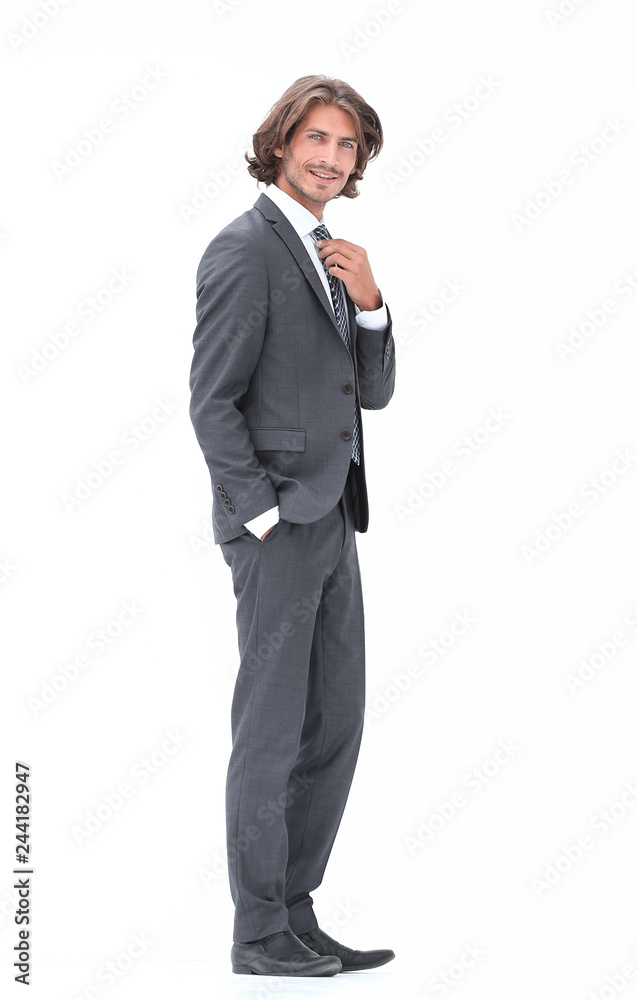 businessman straightening his tie isolated on a white background businessman straightening his tie isolated on a white background