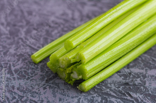 fresh celery, celery stalks close up on grey background