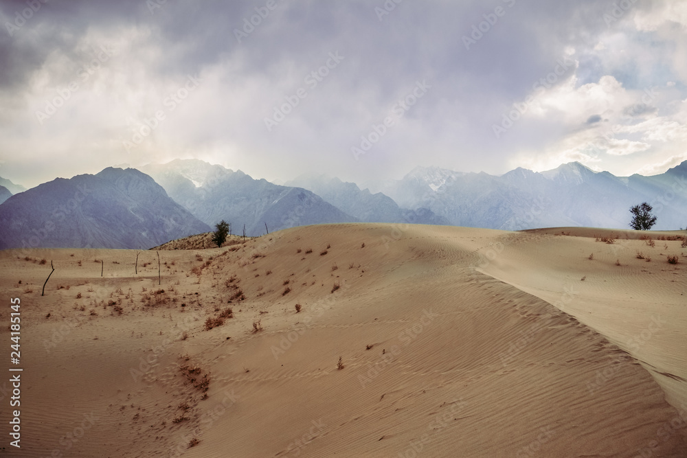 View of sunset and cloudy sky at the Katpana cold desert Skardu, Gilgit Baltistan, Pakistan. View of sunset and cloudy sky at the Katpana cold desert Skardu, Gilgit Baltistan, Pakistan.
