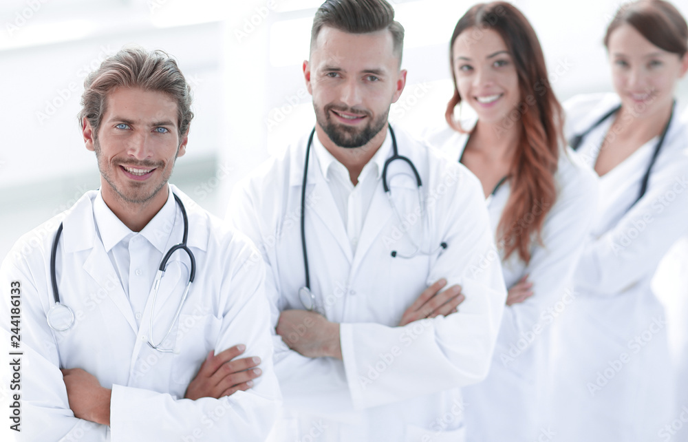 Portrait of medical team standing with arms crossed in hospital Portrait of medical team standing with arms crossed in hospital