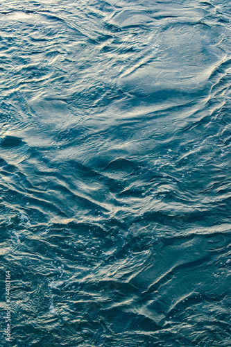 Fototapeta Naklejka Na Ścianę i Meble -  Blue and turquoise water with irregular wave structure