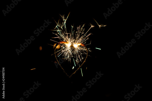 Fire sparklers on black background - Image