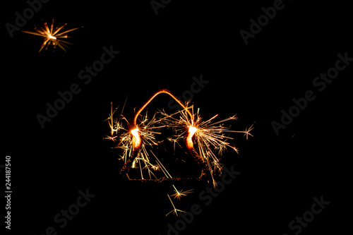 Fire sparklers on black background - Image