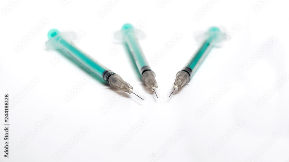 Fototapeta premium Insulin syringes on a white background.