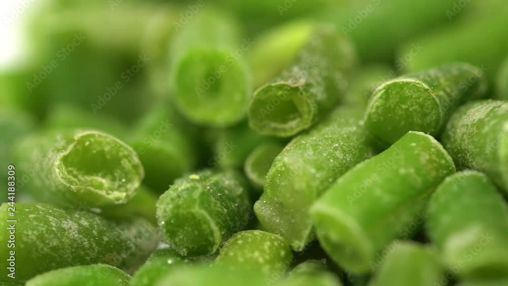 Closeup macro video of frozen icy sliced sprouts of green beans rotating slowly around. Slow motion hd video footage. Closeup macro video of frozen icy sliced sprouts of green beans rotating slowly around. Slow motion hd video footage.