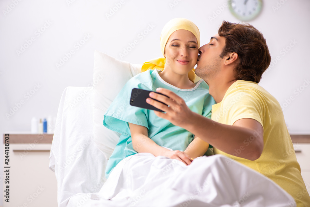 Fototapeta premium Husband looking after wife in hospital