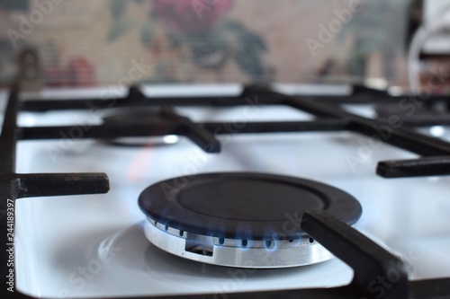 Gas stove, blue fire. The use of domestic gas for domestic purposes. 