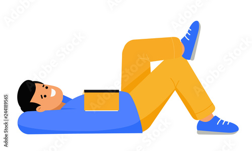 The man is resting. The guy lies on his back with his hands behind his head. Student reading a book.