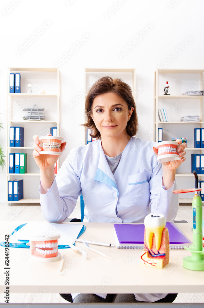 Female doctor working on new teeth implant 