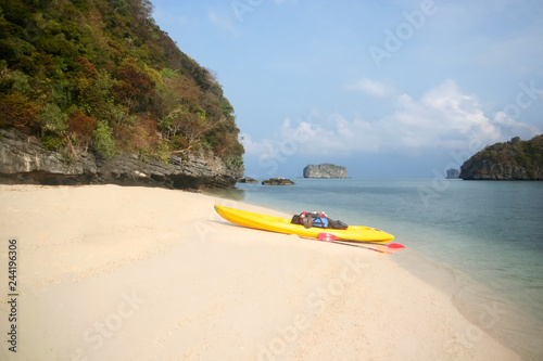 Kayaking with camping supplies on the beach at archipelago island