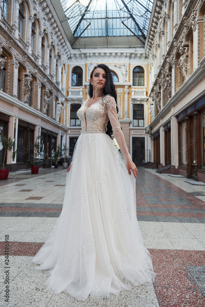 Beautiful delicate young woman, sexy bride in luxurious wedding dress