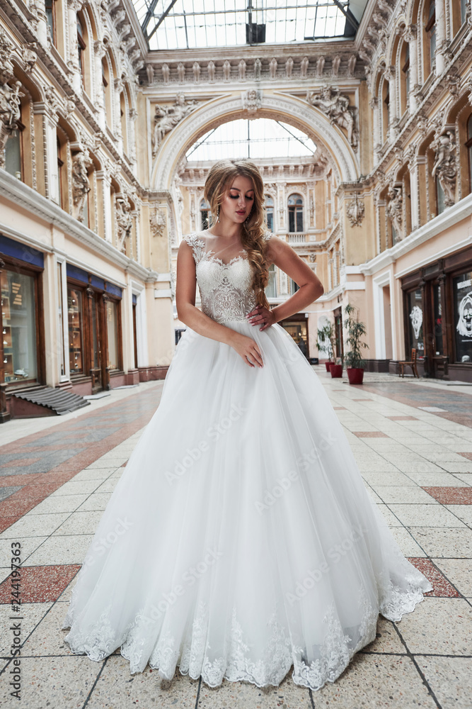 Obraz premium Beautiful sexy woman in a wedding dress in a charming castle.
