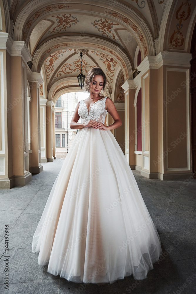 Obraz premium Beautiful sexy woman in a wedding dress in a charming castle.