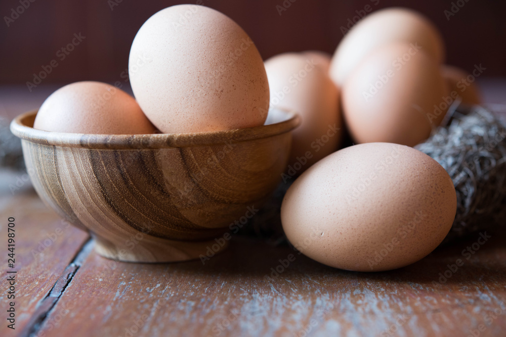 Eggs in wooden bowl and bird net Eggs in wooden bowl and bird net
