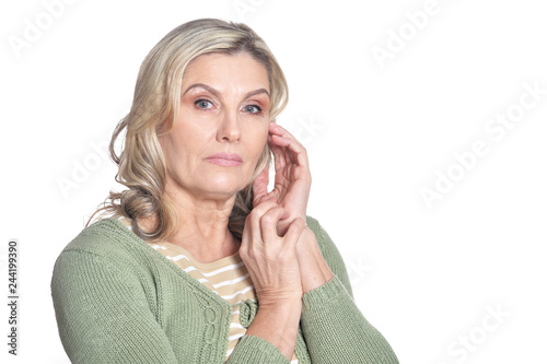 Portrait of beautiful mature woman posing on white background