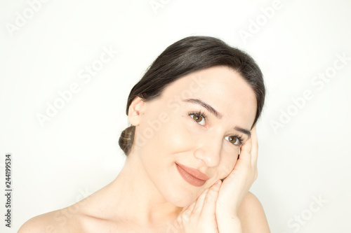 Smiling beautiful young woman with clean and healthy skin