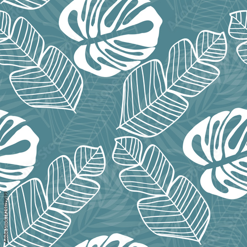 Tropical seamless pattern with leaves. White tropical leaves on blue background. Banana leaves, monstera leaves, palm leaves.