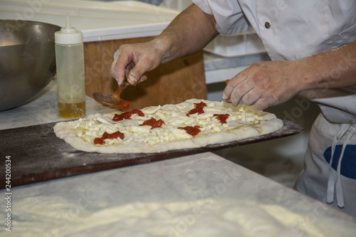 Processing of the Pizza Dough by the Pizza Maker