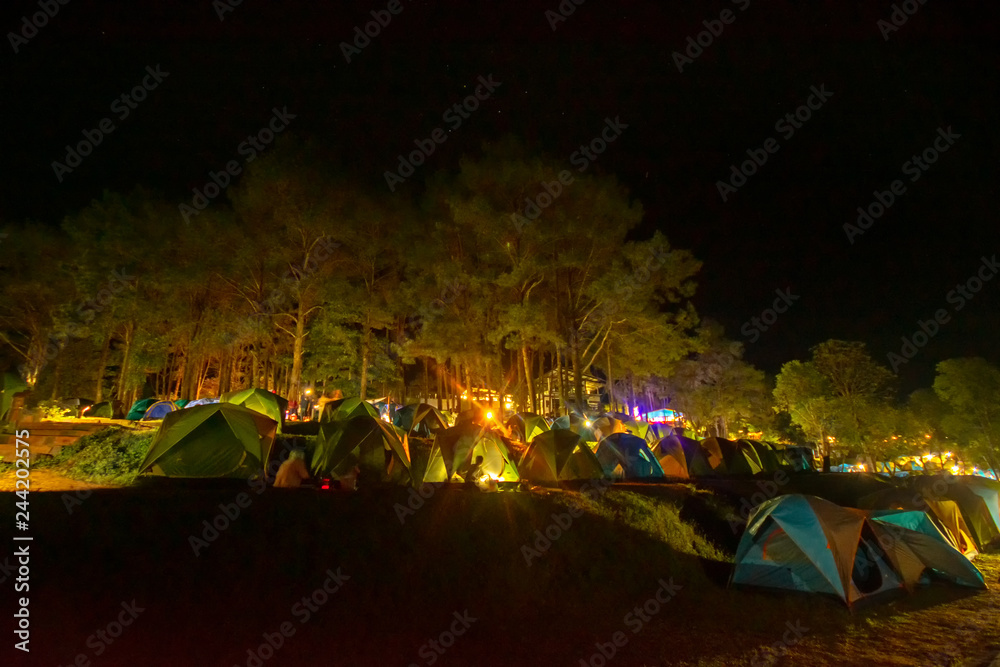 Night Adventures Camping tourism and tent ,view forest landscape , outdoor in morning and sunset sky at Mon Sone View point , Doi Pha Hom Pok National Park in Chiang Mai,North Thailand. Concept Travel
