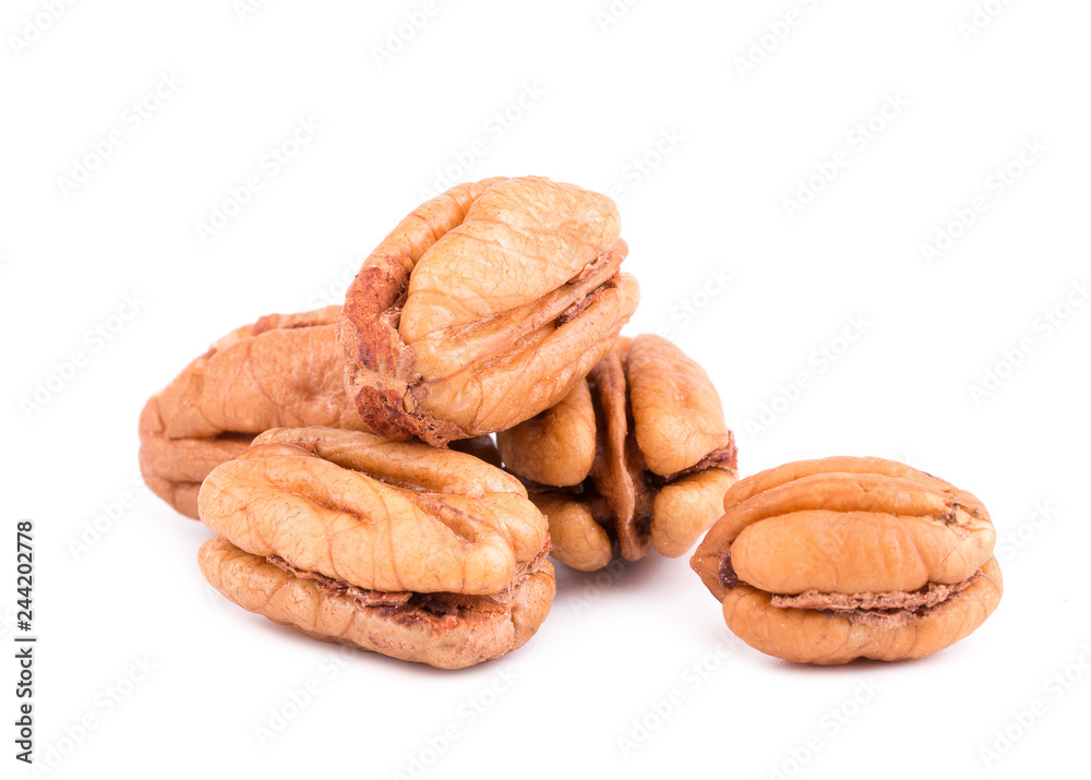 Pile of pecan nuts isolated over the white background. Bunch of peeled pecans