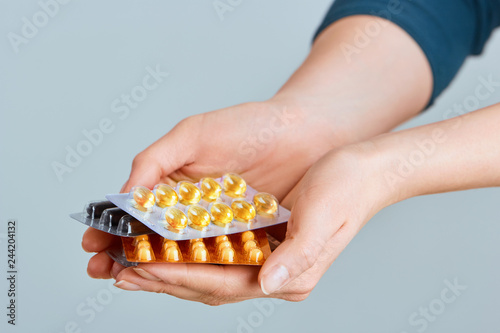 Vitamins And Supplements. Closeup Of Woman Hands Holding Variety Of Colorful Vitamin Pills. Close-up Handful Of Medication, Medicine Tablets, Capsules. Healthy Diet Nutrition Concept.