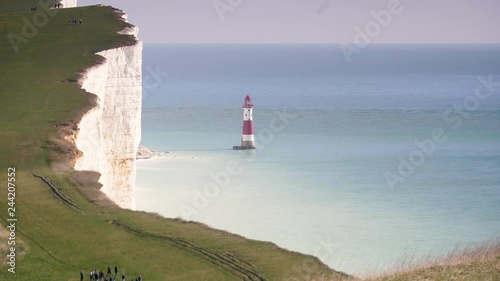 Beachy Head lighthouse. A view of the lighthouse by the white cliffs of Beachy Head on the South Downs, a national park on the south coast of England.