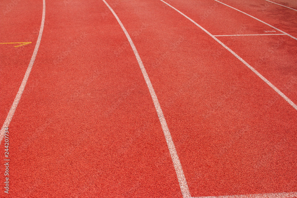 Red running track Synthetic rubber on the athletic stadium.