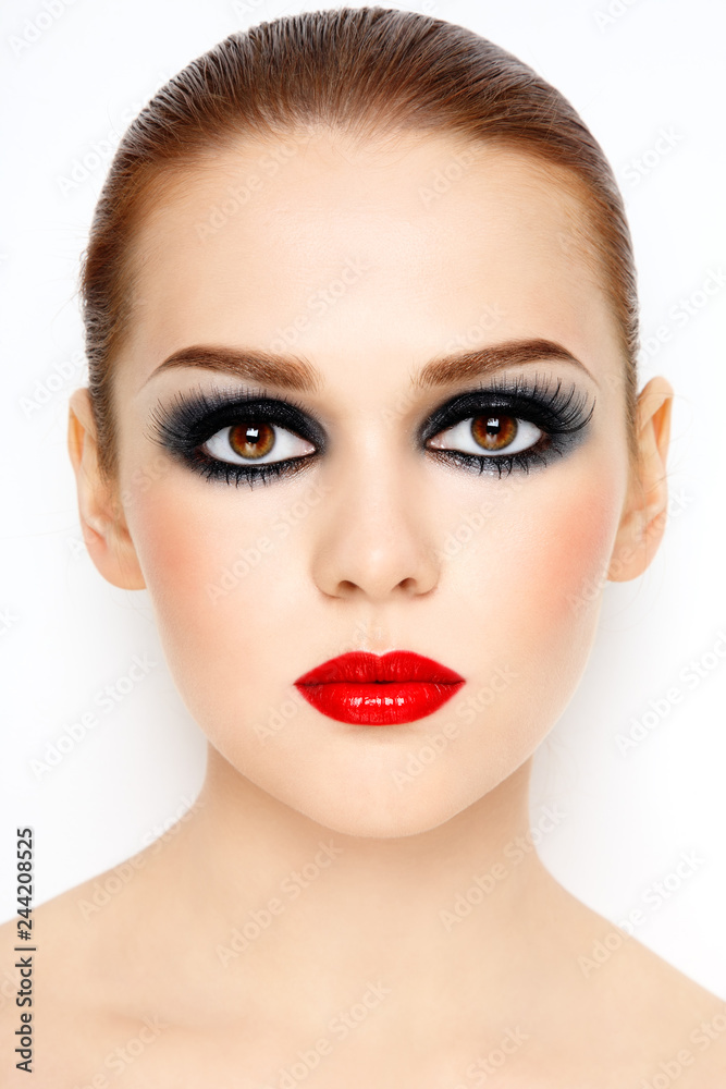 Portrait of young beautiful woman with fancy smoky eye make-up